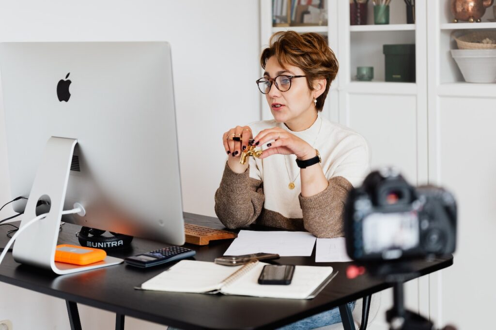 women sitting infront of the computer